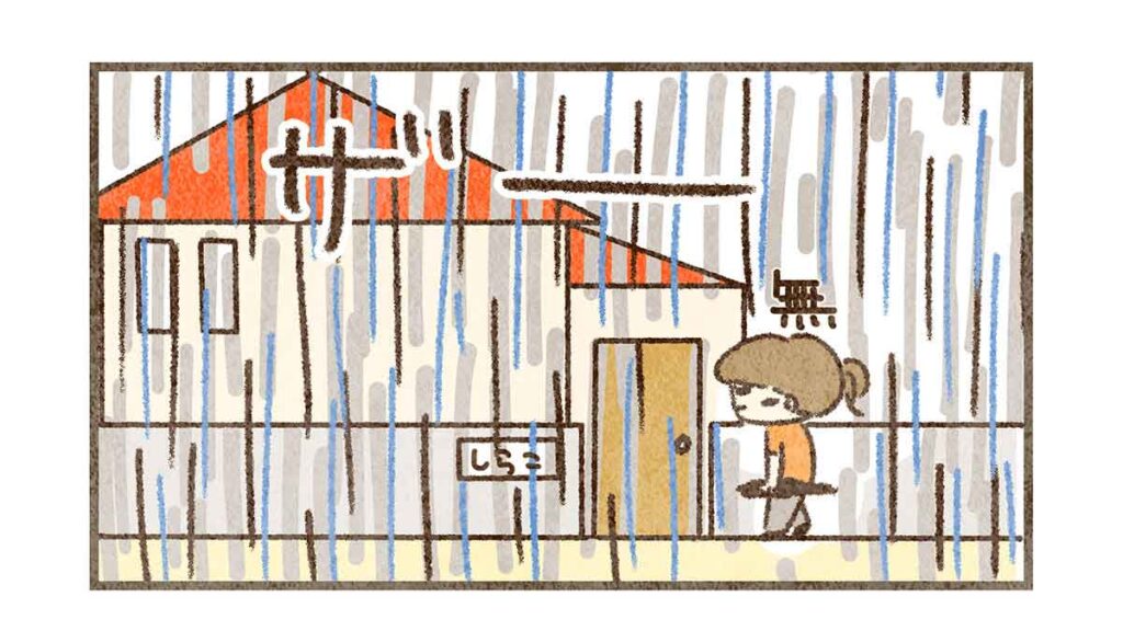 大雨の中歩いて帰るママ